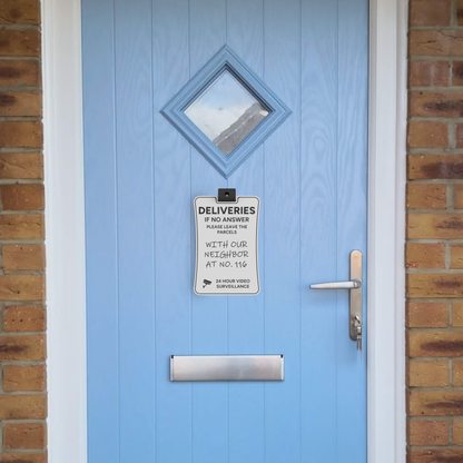 Custom delivery sign mounted beside the letterbox on a blue front door, telling couriers where to leave parcels