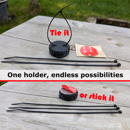 Basic AirTag holder on a garden table with zip ties and an adhesive pad: tie it or stick it