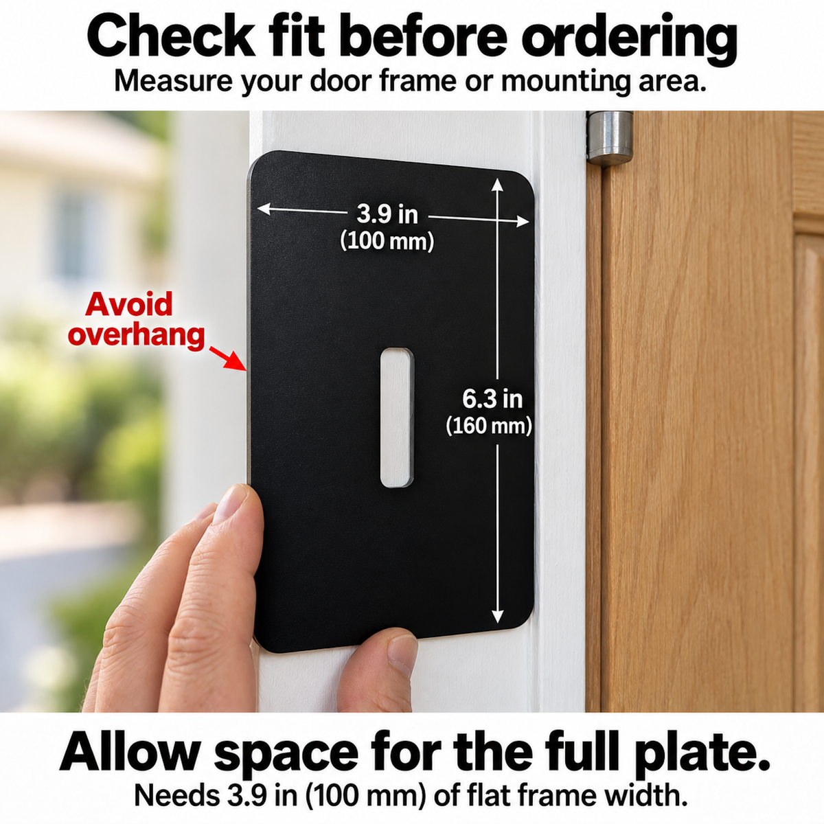 Hand holding the 100 x 160 mm black plate against a door frame to check there is 100 mm of flat width